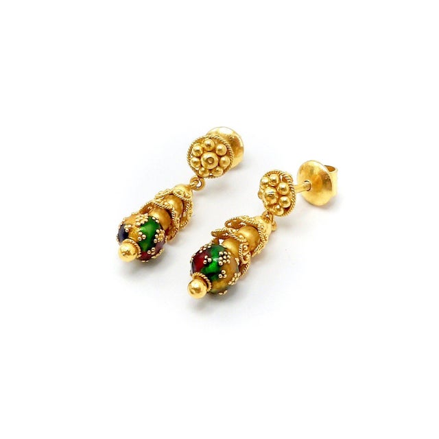 This pair of dangling 22 karat yellow gold Indian Cannetille earrings are a stacking of elements, small gold beads,...