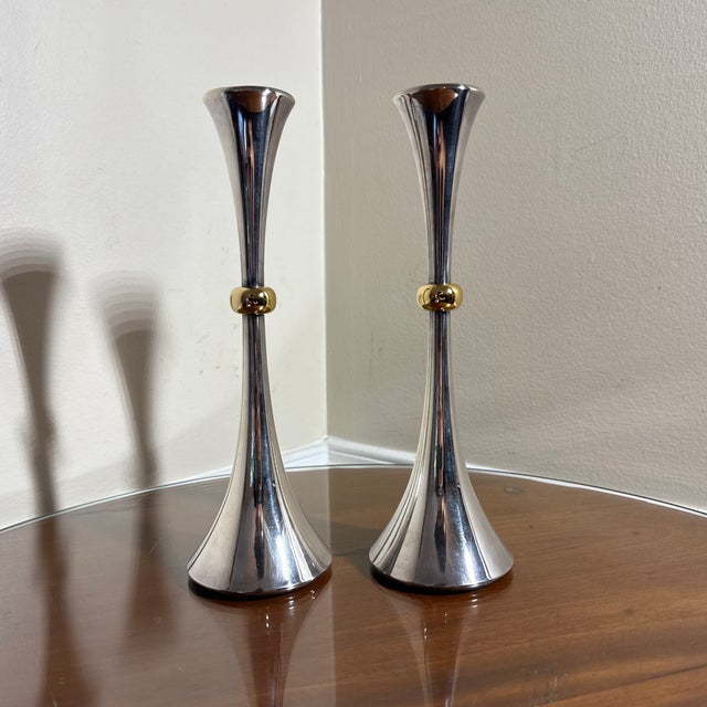 Beautiful brass on chrome candlesticks, good look and size! True Midcentury feel/design Stamped made in Japan on the bottom