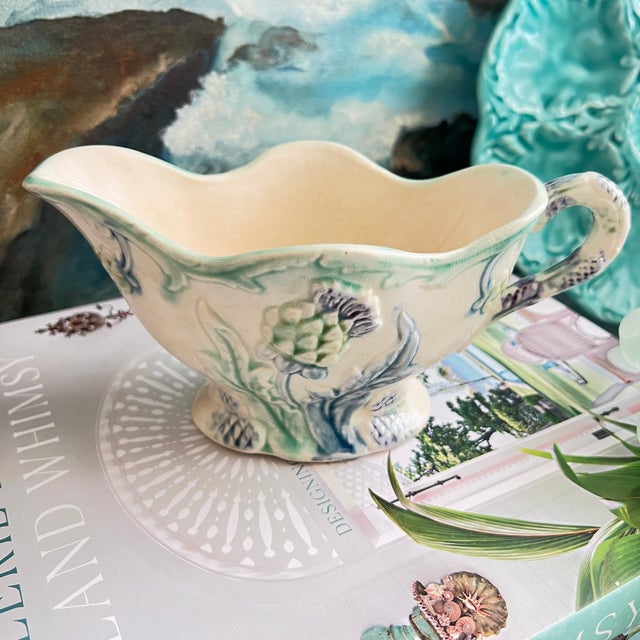 French majolica gravy boat with artichoke design in pales shades of green and blue. This design was created in Fives-Lille...