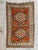 Exquisite vintage Turkish rug from the Kars region, dating back to the mid-20th century. This handmade masterpiece...