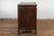 A Chinese late Qing Dynasty period bedside cabinet from the early 20th century with four drawers and double doors. This...