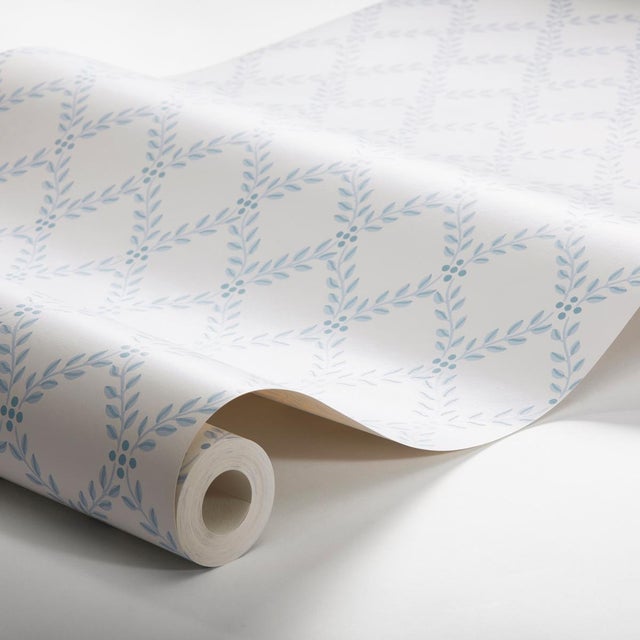 The wallpaper by BorÃ¥stapeter is a classic trellis print of elegantly arranged foliage. Trellis Leaves in blue makes a...