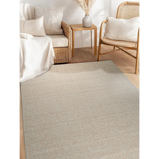 Freya Graceful Pink Handmade Wool Rug, Country of Origin: India. This piece exemplifies the modern artisanal quality found...