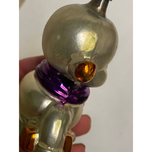 This is the cutest West German handblown snowman Christmas Tree ornament with a purple scarf. It is so round and jolly and...