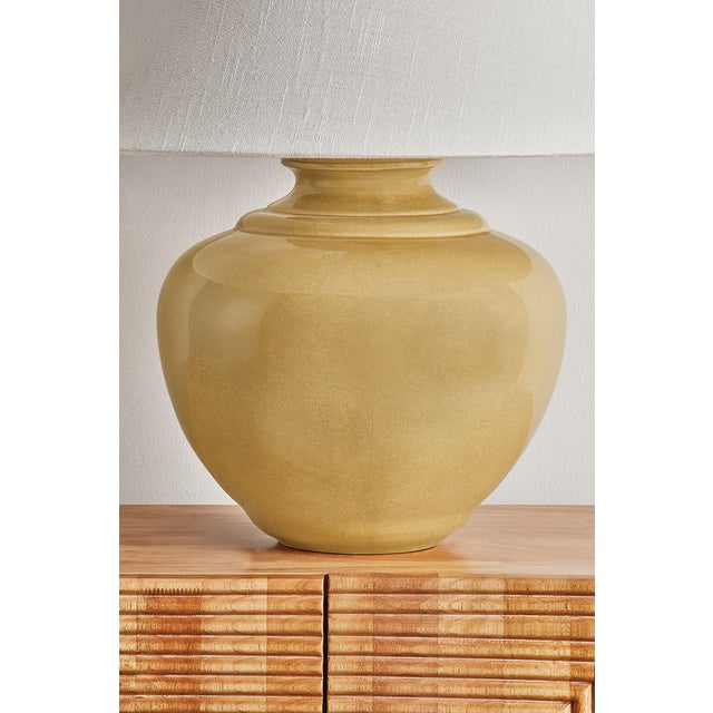 Add a punch of color to your space with the French Ridge table lamp. This ceramic beauty is glazed in a Dijon hue that...