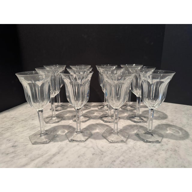 Beautiful set of Baccarat crystal wine glasses in the popular Malmaison pattern. Twelve in set. Each wine glass is signed....