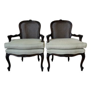 Vintage French Louis XV Style Carved Walnut & Cane Back Arm Accent Chairs – A Pair For Sale