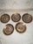 An exquisite set of five (5) antique Royal Vienna style porcelain cabinet plates, showcasing a striking crimson (maroon)...