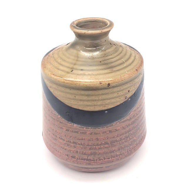 Offered is a mid 20th Century ovoid form salt-glazed studio pottery vase, circa. 1960s to 1970s. There is no visible...