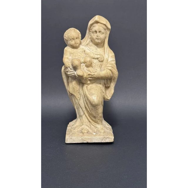 Italian (Emilian) marble sculpture depicting the Madonna and Child from the 16th century. The theme of motherhood and the...