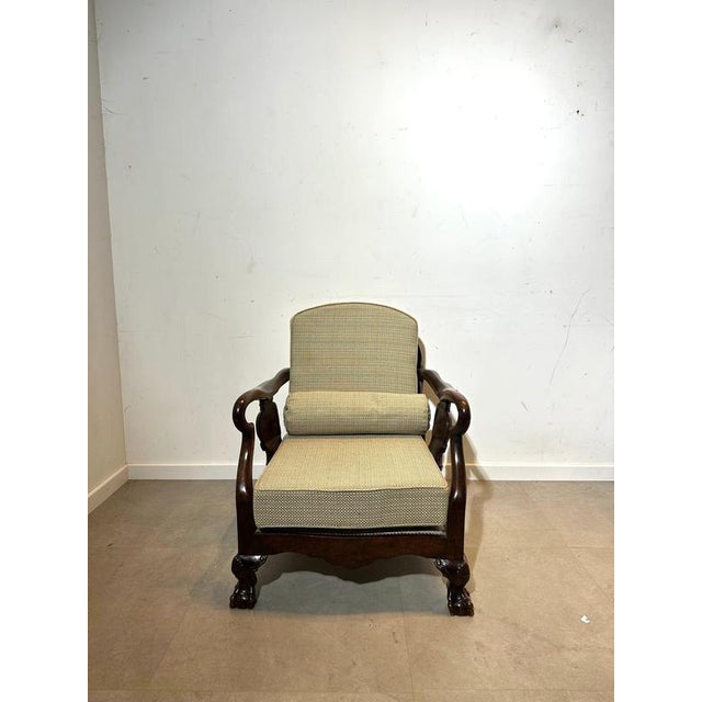 Bring timeless elegance into your interior with this beautifully crafted Chippendale armchair. Featuring a solid carved...