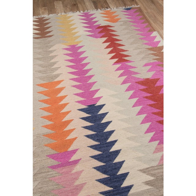 Bright fun colors give a modern twist to the traditional kilim patterns found in the Caravan Collection. Hand woven in...