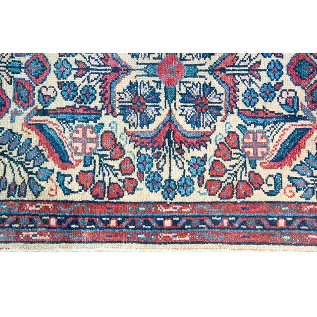 This petite early 20th-century Persian Dargazine rug is a captivating example of fine craftsmanship from the Hamadan...