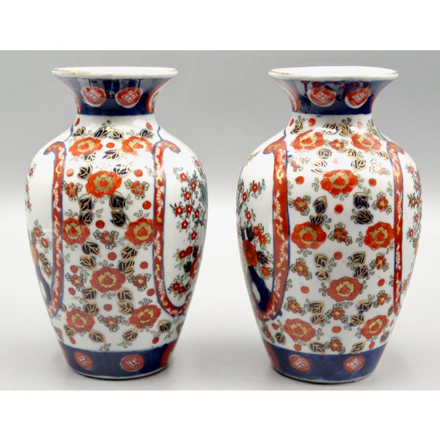 Antique fine quality pair of Japanese porcelain Imari vases.. Circa 1900, they are hand painted in s traditional colors...