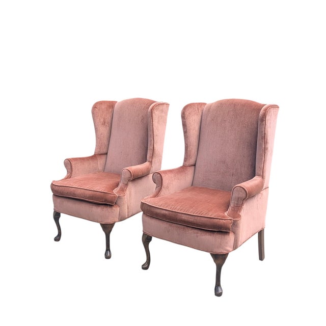 A pair of Crushed Velvet Rose Gold Wingback Upholstered Arm Chairs Made by Marlow Furniture Company in Hickory, NC The...