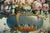 Carlo De Tommasi’s Flowers presents a richly composed floral still life arranged through a sophisticated balance of...