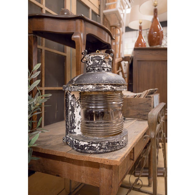 An early 1900s Ward Hendrickson Marine masthead ship lantern featuring a glass fresnel lens, steel metal frame, and...