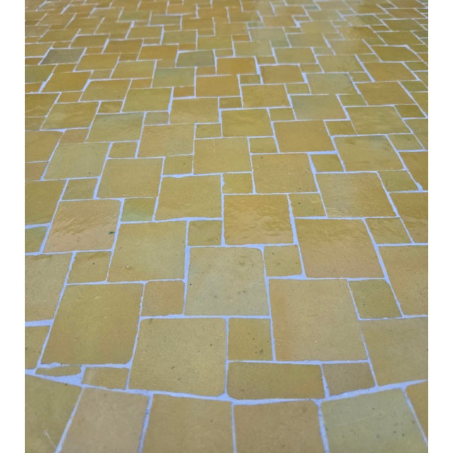 Beautiful handcrafted Moroccan mosaic table featuring an elegant yellow color palette. Measuring 48 inches in diameter,...