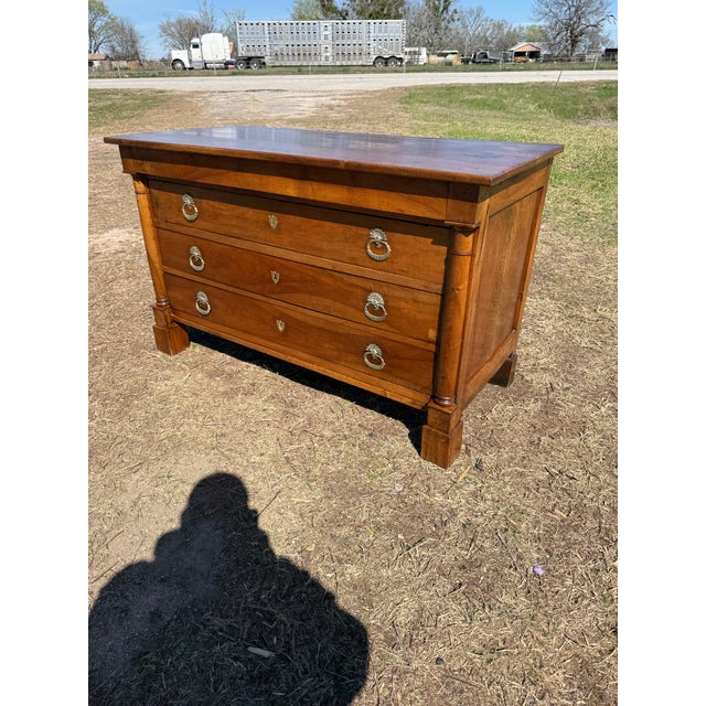 19th Century French Empire Commode from France. Made of walnut, the wood has been finished with a lustrous French polish,...