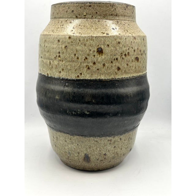 A large early stoneware vase by California ceramic artist Sheldon Kaganoff, dated 1968. The wheel-thrown vessel features a...