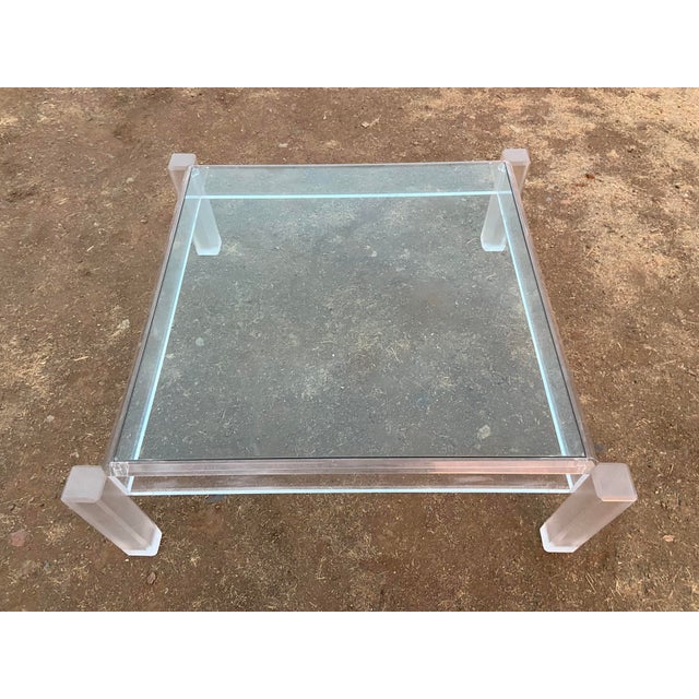 This Vintage Mid Century Modern Lucite Glass Top Coffee Cocktail Table is a unique and stylish addition to any room. Made...