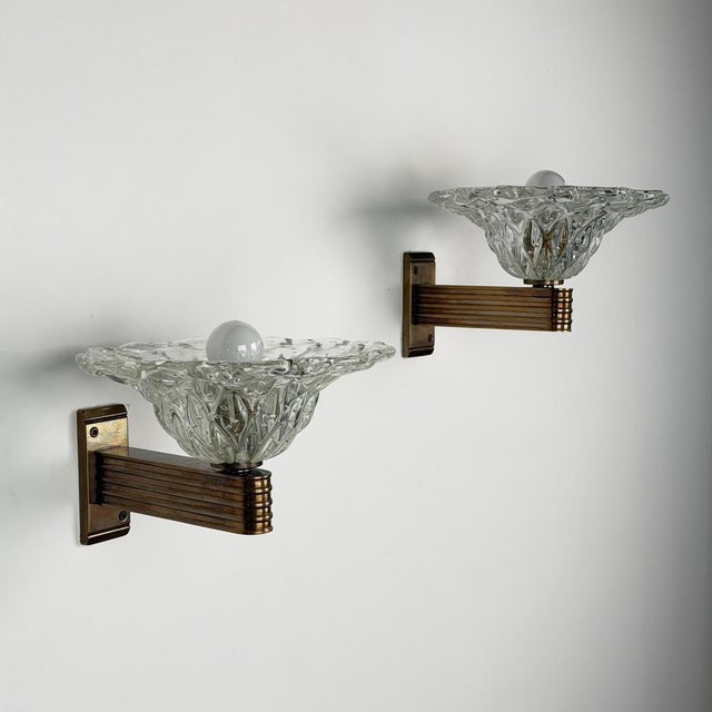 An exceptional and rare pair of Murano wall sconces designed by Ercole Barovier for Barovier & Toso, circa 1940. Each...