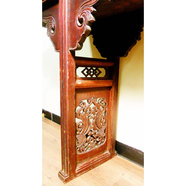 This antique Chinese altar table is circa the early 19th century. Traditional Chinese "Auspicious" patterns decorate the...