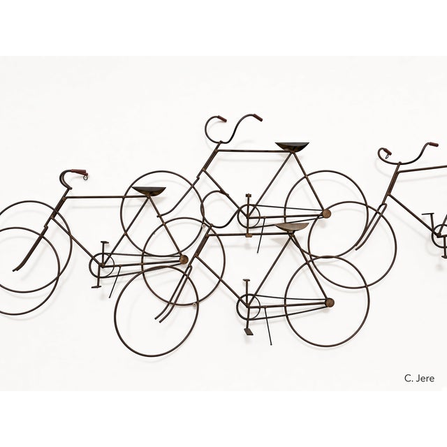 Authentic vintage C. Jeré (Curtis Jere) wall sculpture of overlapping bicycles, signed and dated © C. Jere ’72. Produced...