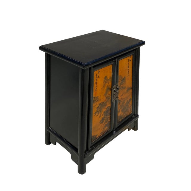 This is an oriental-style end table nightstand painted with a distressed dark brown-black surface. A simple metal door...