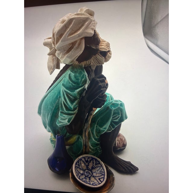 An exquisite collectible porcelain sculpture by Algora of Spain, titled Bedouin at Rest. This finely detailed figurine...