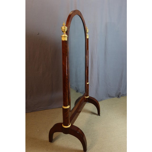 Superb empire period mahogany cheval mirror. This one has been fully restored and is of exceptional quality. The bronze...