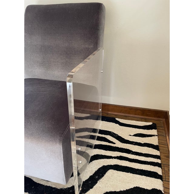 1980s era club chair with a periwinkle performance velvet seat and acrylic sides/arms. Perfect combination of levity and...