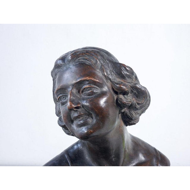Terracotta sculpture bust of a young woman. Italy, mid-twentieth century origin italy period mid-twentieth century...