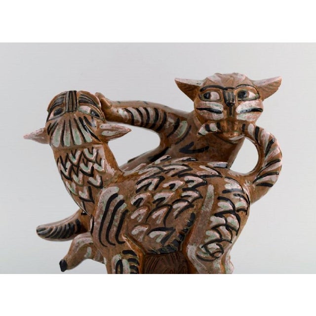 Helge Christoffersen (1925-1965), Denmark. Unique figure in hand-painted and glazed stoneware. Playing cats. Mid-20th...