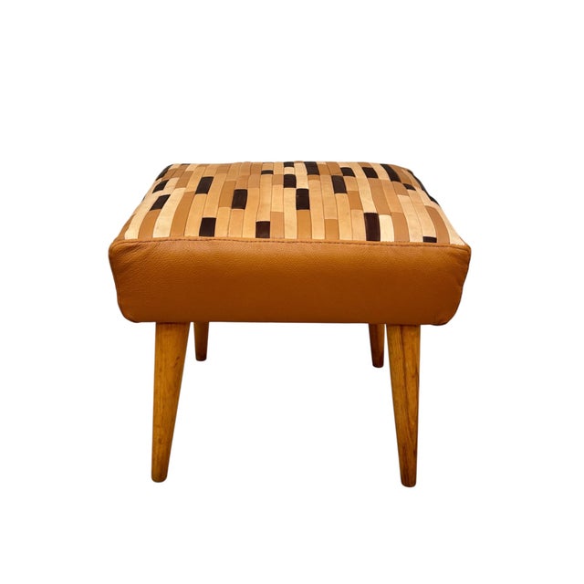 Stylish mid-century modern ottoman, Europe 50s. Solid beech conical legs, recently restored and upholstered in patchwork...