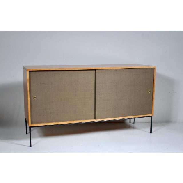 Paul McCobb Planner Group for Winchendon Furniture Co. Maple 2 Door, 4 Drawer Buffet Cabinet. Featuring a solid Maple...