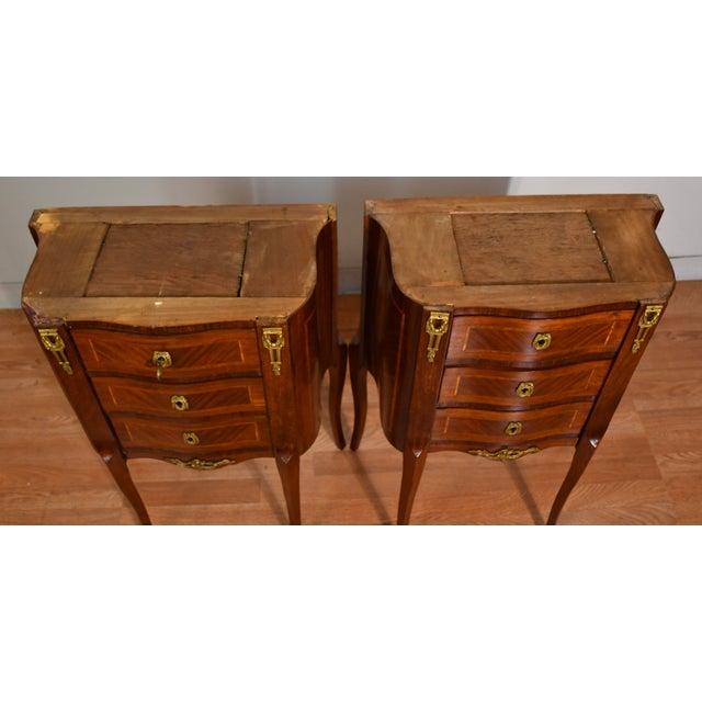 We are pleased to offer this beautiful Antique PAIR of French Louis XV Nightstands, from the 1900. This pair is made of...