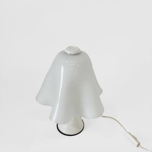 Stunning Murano glass table lamp, “Ghost" model, original from the 1970s. Handcrafted by Murano master glassmakers, this...