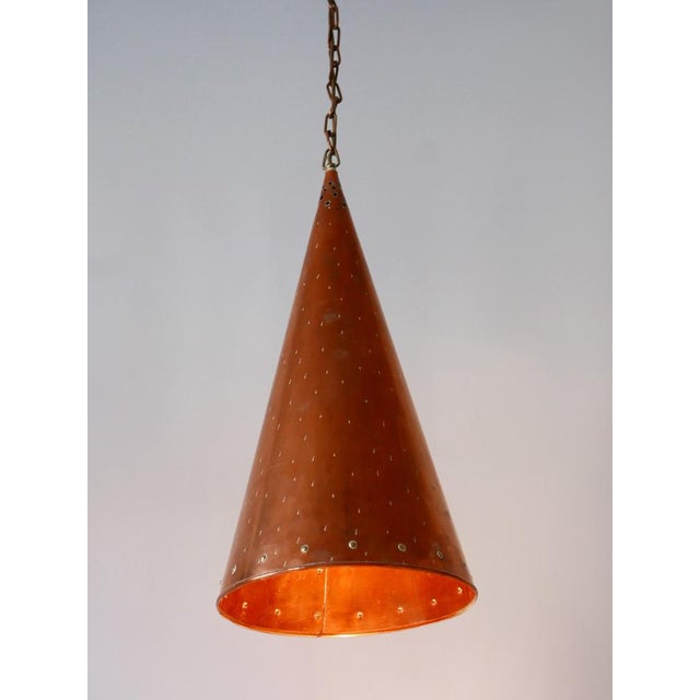 Lovely and highly decorative mid-century modern cone pendant lamp or hanging light. Designed and manufactured by e.s. Horn...