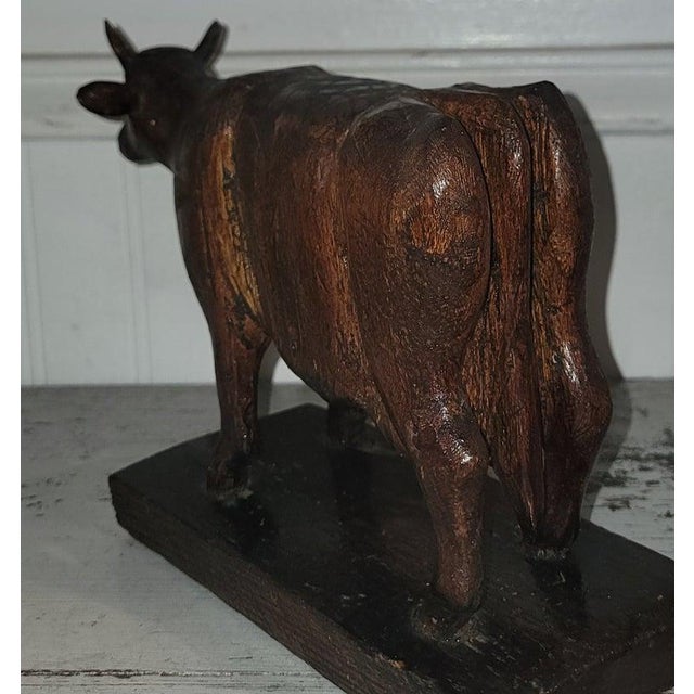 Hand Carved and signed Wooden Cow in very good condition as found. Signed by the artist M.O.Thomas. Amazing undisturbed...
