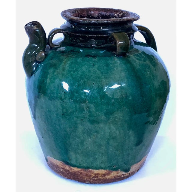 The glaze on this old jug has so much depth in the varied colors of greens and blues. Collar has three rope loops along...