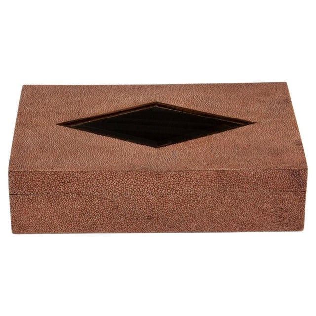 This luxurious brown shagreen box is a testament to exceptional craftsmanship, featuring a sleek diamond-shaped glass...