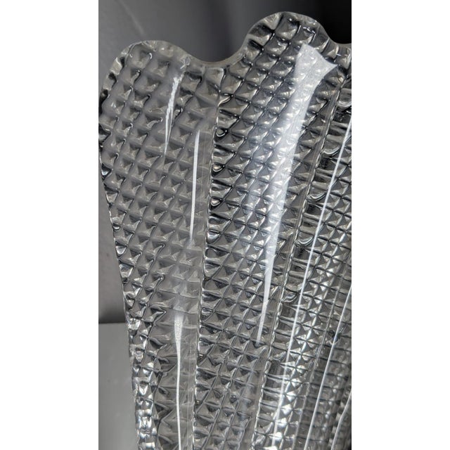 Illuminate your space with a piece of Italian art history. This exquisite wall lamp is a genuine work from the legendary...