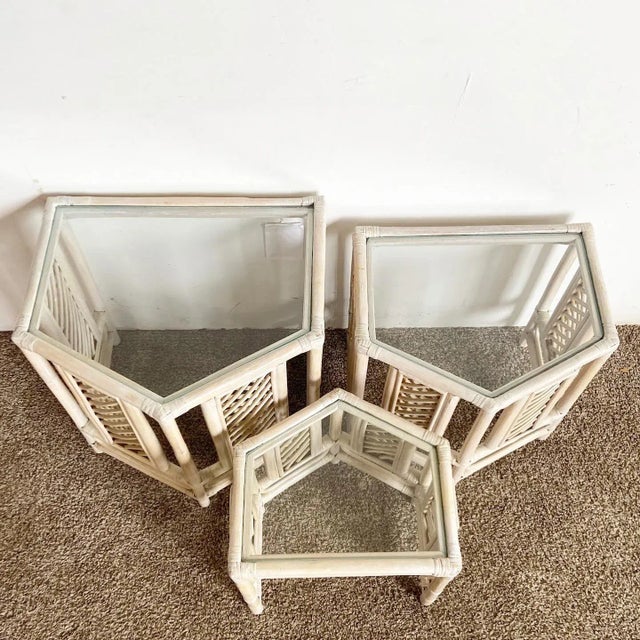Amazing set of 3 vintage boho chic bamboo rattan pentagonal nesting side tables. Each feature a white washed finish with a...