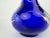 This striking vintage Czech glass vase features an elegant cobalt blue base with hand-painted gold floral motifs. The gold...
