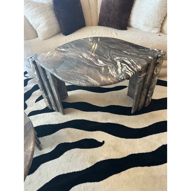 Glamorous Cipollino marble pair of “Eye” end tables or cocktail tables attributed to Roche Bobois. Capturing the bold...