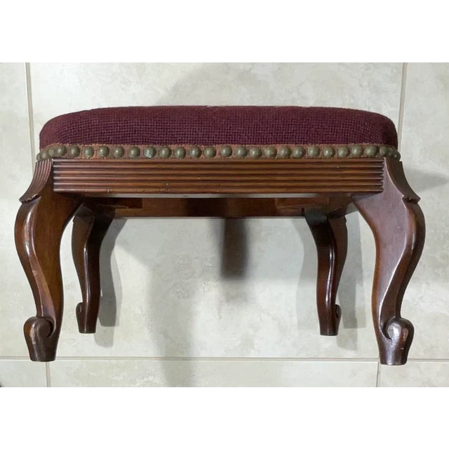 Petite Elegant foot stool made hand carved woof wood, upholstered with beautiful floral motif needlepoint textile. Great...