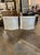 The product is a pair of vintage Italian white painted side cabinets with Carrara marble accents. The cabinets are...