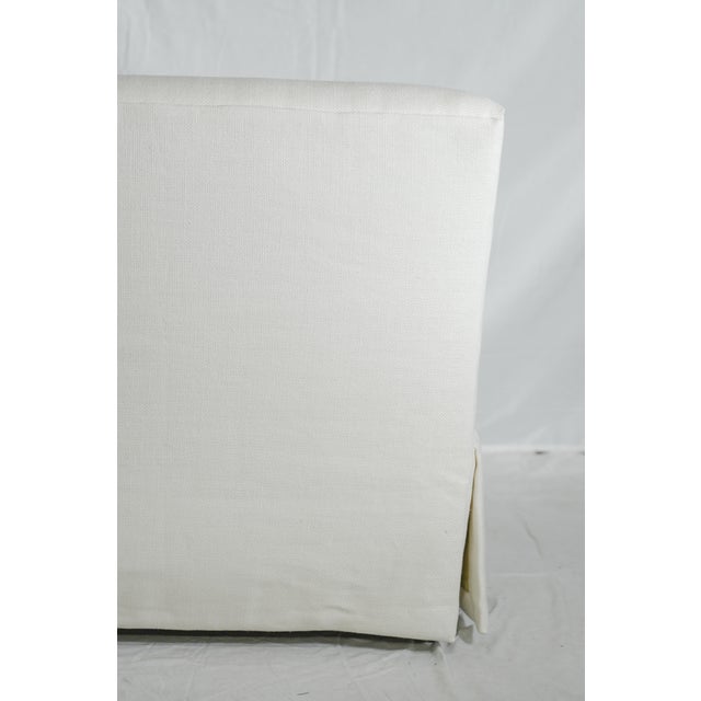 Coastal style with skirts covering tapered beechwood legs. Belgian linen. Premium spring-down cushion balances softness...