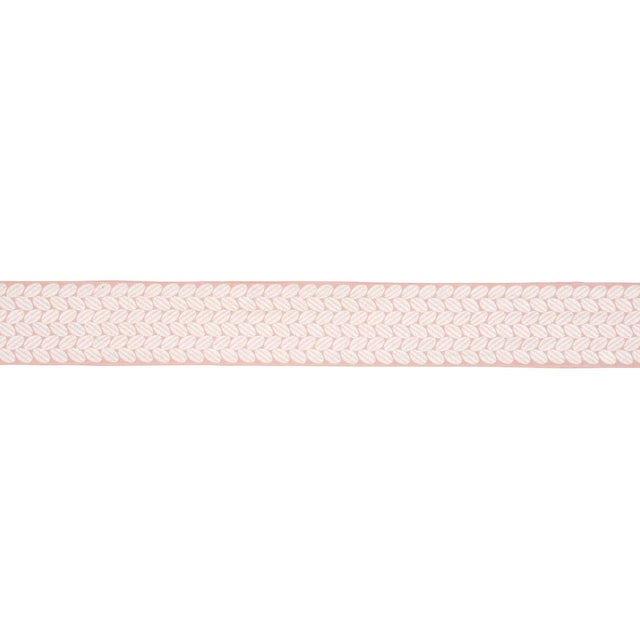 An exuberant embroidered tape with a leaf-like pattern rendered in satin stitching; inspired by a document in our...